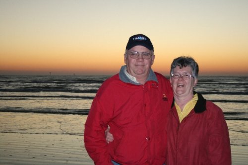 20 gma and poppa on beach.JPG